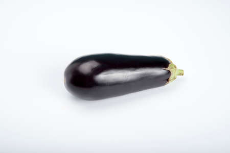 dark red aubergine vegetable on white backgroundの写真素材