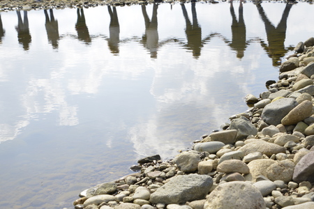 LESVOS, GREECE February 27, 2016: Greek man and woman, children, volunteers and refugees are standing hand in hand to make a message to the world, 'SafePassage'のeditorial素材