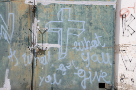 LESVOS, GREECE March 01, 2016: Words written by refugees and volunteers on walls at the Greek island Lesvos. Hotspot Moria, deportation center refugees.のeditorial素材