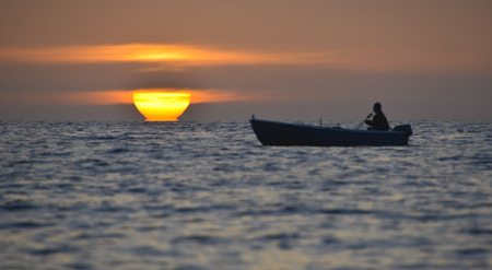 fisherman with boat at Aegean sea, Molivos Lesvosの写真素材