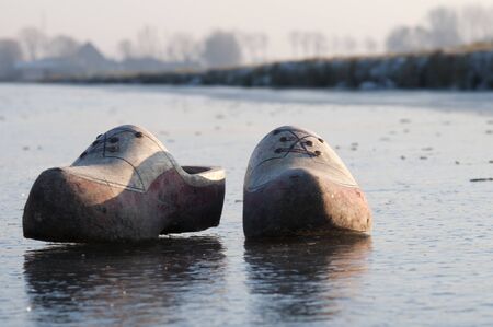clogs on ice in cold winterlandscape