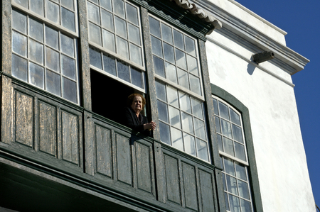 Santa cruz, La Palma: 02-April-2005: Old woman at her window of her a house in Santa Cruzのeditorial素材