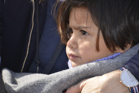 Mytilini, Lesvos, Greece, 03-March-2016: Refugees child arriving at Lesvos. After they flee from their home country. They travel from Turkey to Greece to get to Europe.のeditorial素材