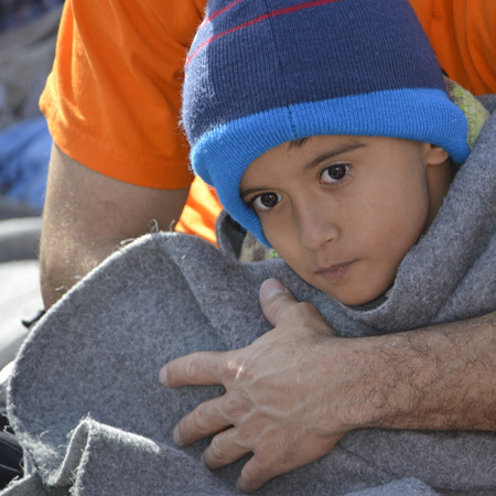 Mytilini, Lesvos, Greece, 03-March-2016: Refugees child arriving at Lesvos. After they flee from their home country. They travel from Turkey to Greece to get to Europe.のeditorial素材