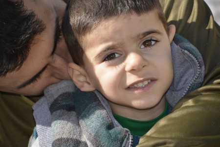 Mytilini, Lesvos, Greece, 03-March-2016: Refugees child arriving at Lesvos. After they flee from their home country. They travel from Turkey to Greece to get to Europe.のeditorial素材