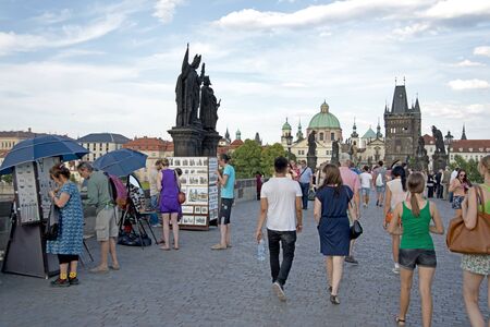 Prague- july 22, 2014: Statue along the North side of Charles Bridge (Karluv Most), Prague, Czech Republic.のeditorial素材