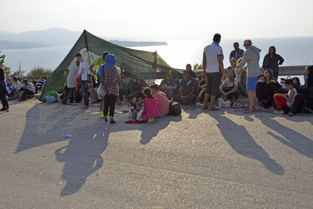 Lesvos, Greece- October 05, 2015. Refugee migrants, arrived on Lesvos in inflatable dinghy boats, they stay in refugee camps waiting for the ferry to mainland Greece continuing their journeys through Europe to seek asylum.のeditorial素材