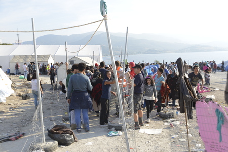 Lesvos, Greece- October 05, 2015. Refugee migrants, arrived on Lesvos in inflatable dinghy boats, they stay in refugee camps waiting for the ferry to mainland Greece continuing their journeys through Europe to seek asylum.のeditorial素材