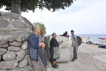 Lesvos, Greece- October 20, 2015. Refugee migrants, arrived on Lesvos in inflatable dinghy boats, they stay in refugee camps waiting for the ferry to mainland Greece continuing their journeys through Europe to seek asylum.のeditorial素材
