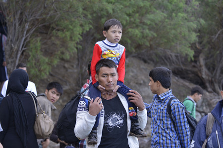 Lesvos, Greece- October 12, 2015, 2015. Refugee migrants, arrived on Lesvos in inflatable dinghy boats, they stay in refugee camps waiting for the ferry to mainland Greece continuing their journeys through Europe to seek asylum.のeditorial素材