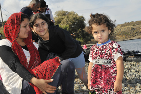 Lesvos, Greece- October 12, 2015, 2015. Refugee migrants, arrived on Lesvos in inflatable dinghy boats, they stay in refugee camps waiting for the ferry to mainland Greece continuing their journeys through Europe to seek asylum.のeditorial素材