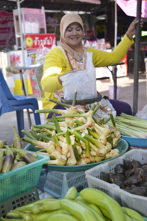 Khao Lak, Thailand, 02-05-2016. Woman selling fresh galangal at takua pa market Thailandのeditorial素材