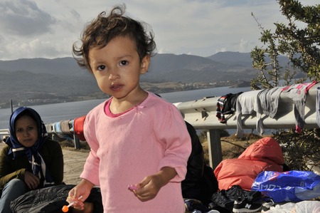 Lesvos, Greece- October 12, 2015, 2015. Refugee migrants, arrived on Lesvos in inflatable dinghy boats, they stay in refugee camps waiting for the ferry to mainland Greece continuing their journeys through Europe to seek asylum.のeditorial素材