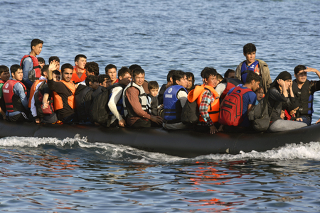 LESVOS, GREECE october 12, 2015: Refugees arriving in Greece in dingy boat from Turkey. These Syrian, Afghanistan and African refugees land their boat at the North coast of Lesvos near Molyvos, Eftalou and Skala Sikaminiaのeditorial素材