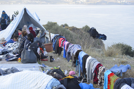 Lesvos, Greece- October 16, 2015. Refugee migrants, arrived on Lesvos in inflatable dinghy boats, they stay in refugee camps waiting for the ferry to mainland Greece continuing their journeys through Europe to seek asylum.のeditorial素材