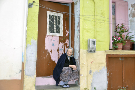 Agiassos Lesvos October21 2015. Greek woman in front of her house in typical Greek village Aggiasos.のeditorial素材