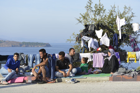 Lesvos, Greece- October 16, 2015. Refugee migrants, arrived on Lesvos in inflatable dinghy boats, they stay in refugee camps waiting for the ferry to mainland Greece continuing their journeys through Europe to seek asylum.のeditorial素材
