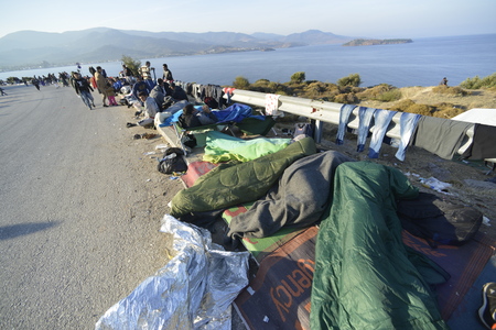 Lesvos, Greece- October 16, 2015. Refugee migrants, arrived on Lesvos in inflatable dinghy boats, they stay in refugee camps waiting for the ferry to mainland Greece continuing their journeys through Europe to seek asylum.のeditorial素材