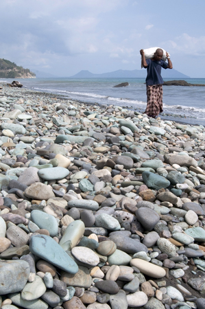Flores-december 02. Blue pebbles at Pengajawa beach Flores Indonesia 02-12-2012のeditorial素材
