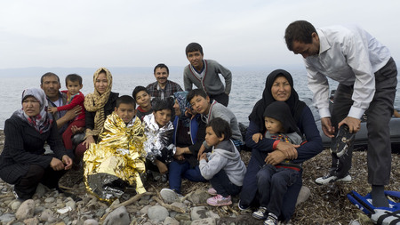 Lesvos, Greece- October 16, 2015. Refugee migrants, arrived on Lesvos in inflatable dinghy boats, they stay in refugee camps waiting for the ferry to mainland Greece continuing their journeys through Europe to seek asylum.のeditorial素材