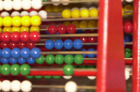 Rows of abaci with shiney beads in a wide variety of colour.の写真素材