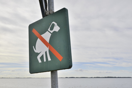 A no dogpoo sign in Marken, the Netherlands. Pick up after your pet.の写真素材