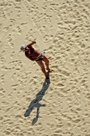 Algarve, Portugal, 24-September-2007: An old man playing beach tennis on the beach in Algarve.のeditorial素材
