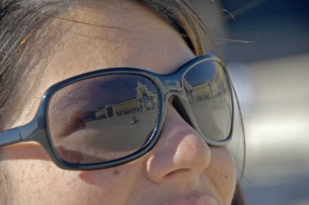 Lisbao, Portugal, 27-September-2007: A woman stares off into the distance as the reflection of her stunning surroundings is visble in her sunglasses in Lisbao.のeditorial素材