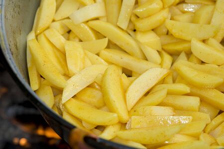 chopped fresh potato to make delicious patats bravasの写真素材