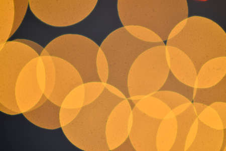 Red orange and yellow bokeh on a black background