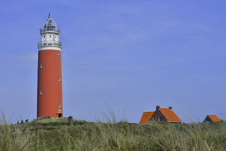 Red lighthouse on the island Texel, The Netherlandsの写真素材
