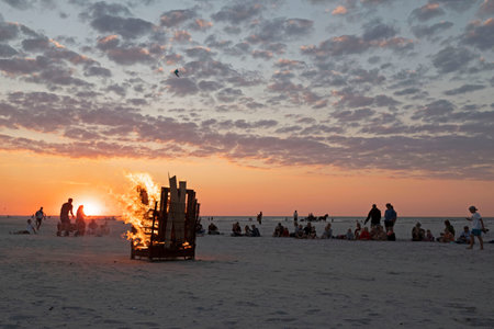Ameland-The Netherlands-13-08-2022: Fire on the beach by sunset.のeditorial素材