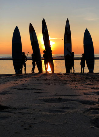Petten-The Netherlands-20-05-2020: Surfboards on the beach at sunset.のeditorial素材