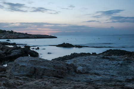 Rocks at the blurred sea watter, long exposureの写真素材