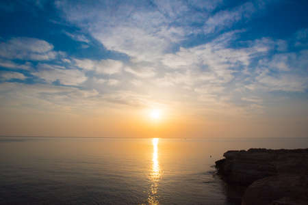 Rocky sea shore on the beautiful sunriseの写真素材