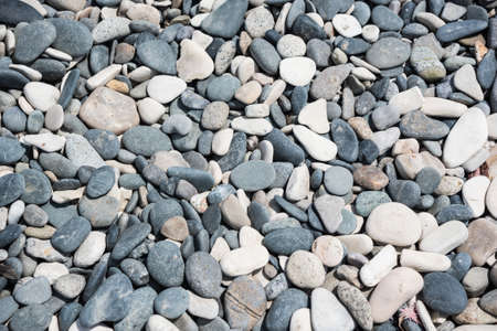 White and grey rounded stones backgroundの写真素材