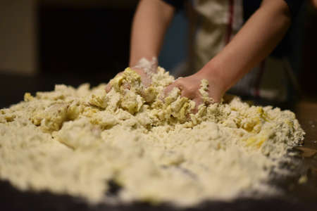 Making dough by child handsの写真素材