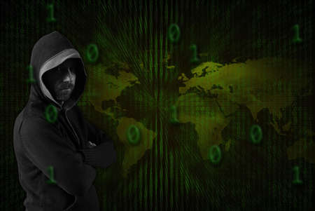 A hacker wearing dark hood over a binary code and a globe