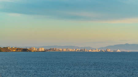 A distant view from a sea side on the forbidden city of Famagusta at sunrise, Cyprusの写真素材