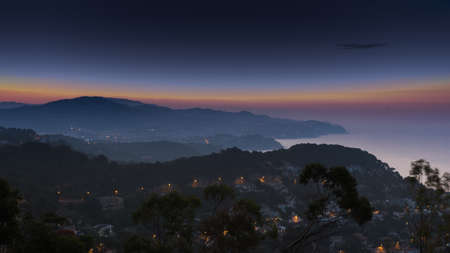 View of sea coast at nightの写真素材