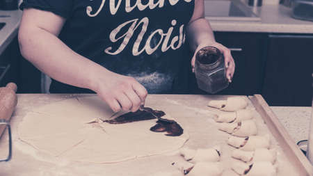 Preparing crescent rollsの写真素材