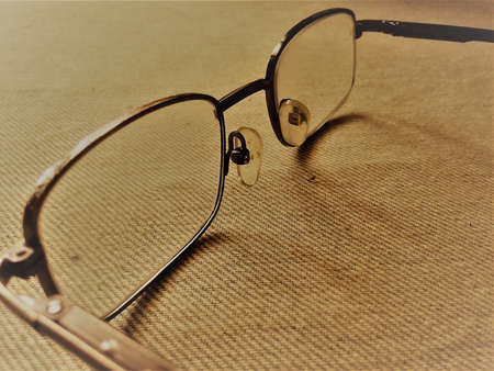Powered Eye glass for eye.Have a steel frame with powered lens on it.Can see the nose support in it.