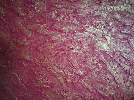A Wall texture made on a wall using two color and gradient.They have used orange and yellow combination for this texture work.There are rough surface on the wall using texture and skilled labour.の写真素材