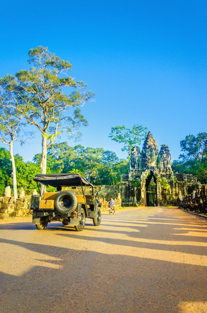 CAMBODIA, SIEM REAP - NOVEMBER 2, 2014: Military car in the path of the temples of Angkor Wat, Siem Reap, Cambodiaのeditorial素材