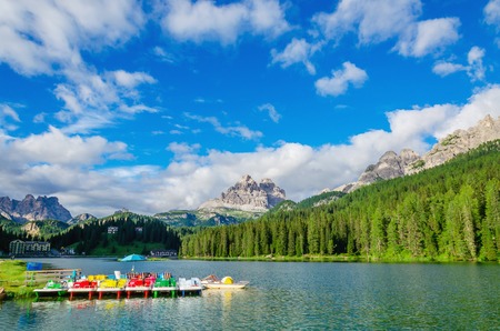 Colored pedalos on the Lake Misurina lago di Santa Caterina and Auronzo di Cadore in Province of Belluno, Veneto in Sexten Dolomites, South Tyrol, Italyのeditorial素材