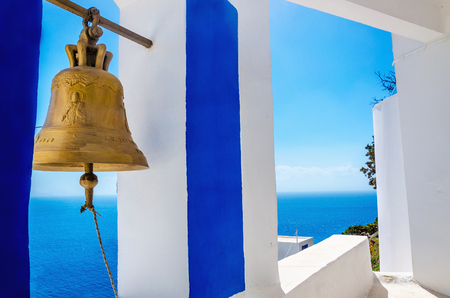 Iconic view on golden bell and typical blue-white church on Greek Island Kalymnos, Greeceのeditorial素材