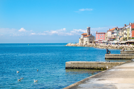Beautiful promenade in Piran with colorful old houses, Slovakia, Europeの写真素材