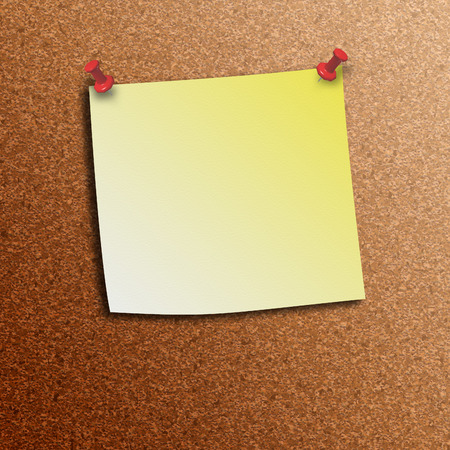 Yellow stick note pinned with push pinsの写真素材