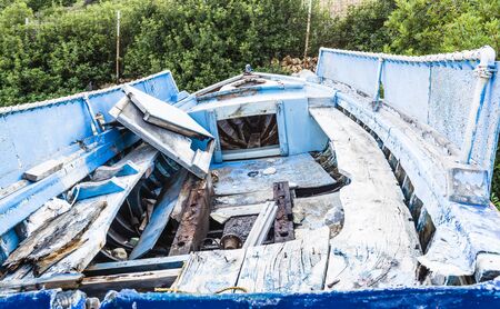 Abandoned fishing boat on beach at Alonissos, Greeceの写真素材