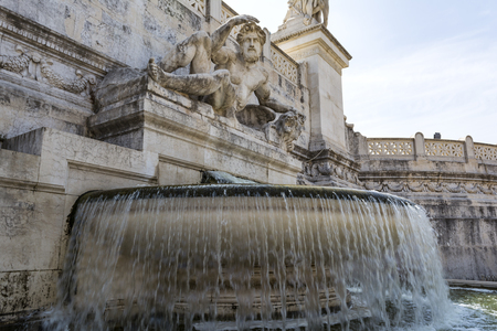 Fontana Del Tirreno is a large fountain with a statue symbolizing the Tyrrhenian sea. It is located in Piazza Venezia at Rome, Italyの写真素材